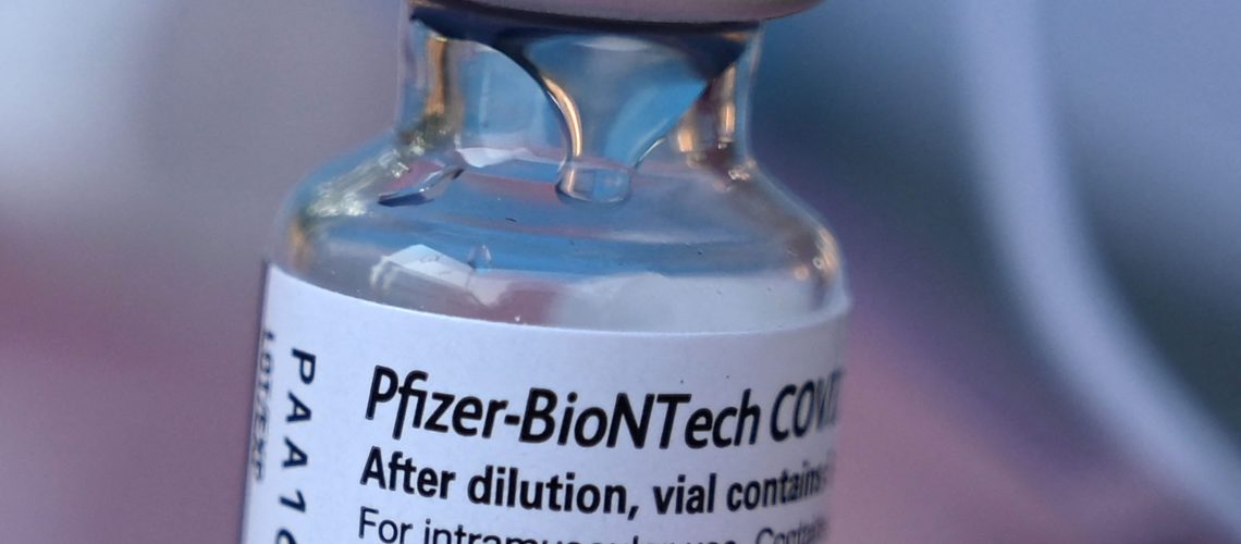 (FILES) In this file photo taken on August 23, 2021, Pfizer-BioNTech Covid-19 vaccine,at a pop up vaccine clinic in the Arleta neighborhood of Los Angeles. - People who received Johnson & Johnson's Covid-19 vaccine may benefit from a booster dose of Pfizer or Moderna, preliminary results of a US study published October 13, 2021 showed. (Photo by Robyn Beck / AFP)