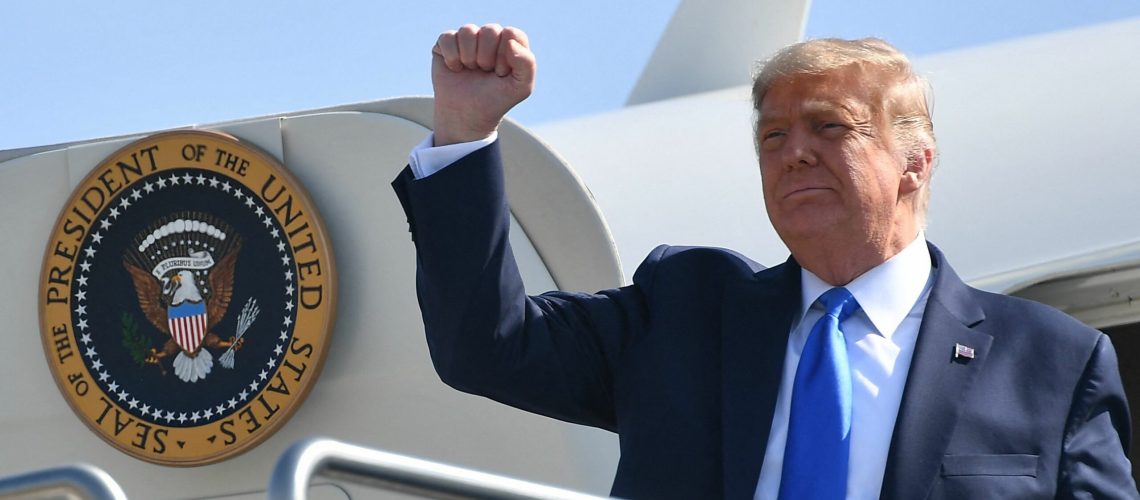 (FILES) In this file photo taken on October 18, 2020 US President Donald Trump steps off Air Force One upon arrival at John Wayne Airport in Santa Ana, California. - A New York grand jury on March 30, 2023, indicted Donald Trump over hush money payments made to a porn star during his 2016 campaign, making him the first former US president to face criminal charges. (Photo by MANDEL NGAN / AFP)