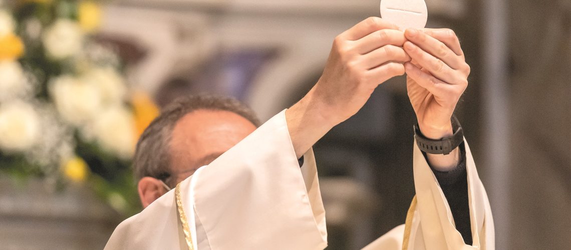 The elevation of the Sacramental Bread during the catholic liturgy