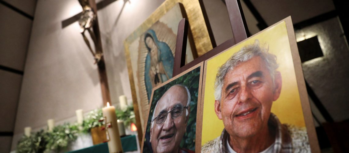 Photos of two priests Javier Campos and Joaquin Mora who were murdered, are pictured during a mass after Mexican authorities said that they are searching for their bodies along with others who were kidnapped in a violent stretch of northern Mexico, at San Ignacio de Loyola church in Mexico City, Mexico June 21, 2022. REUTERS/Edgard Garrido